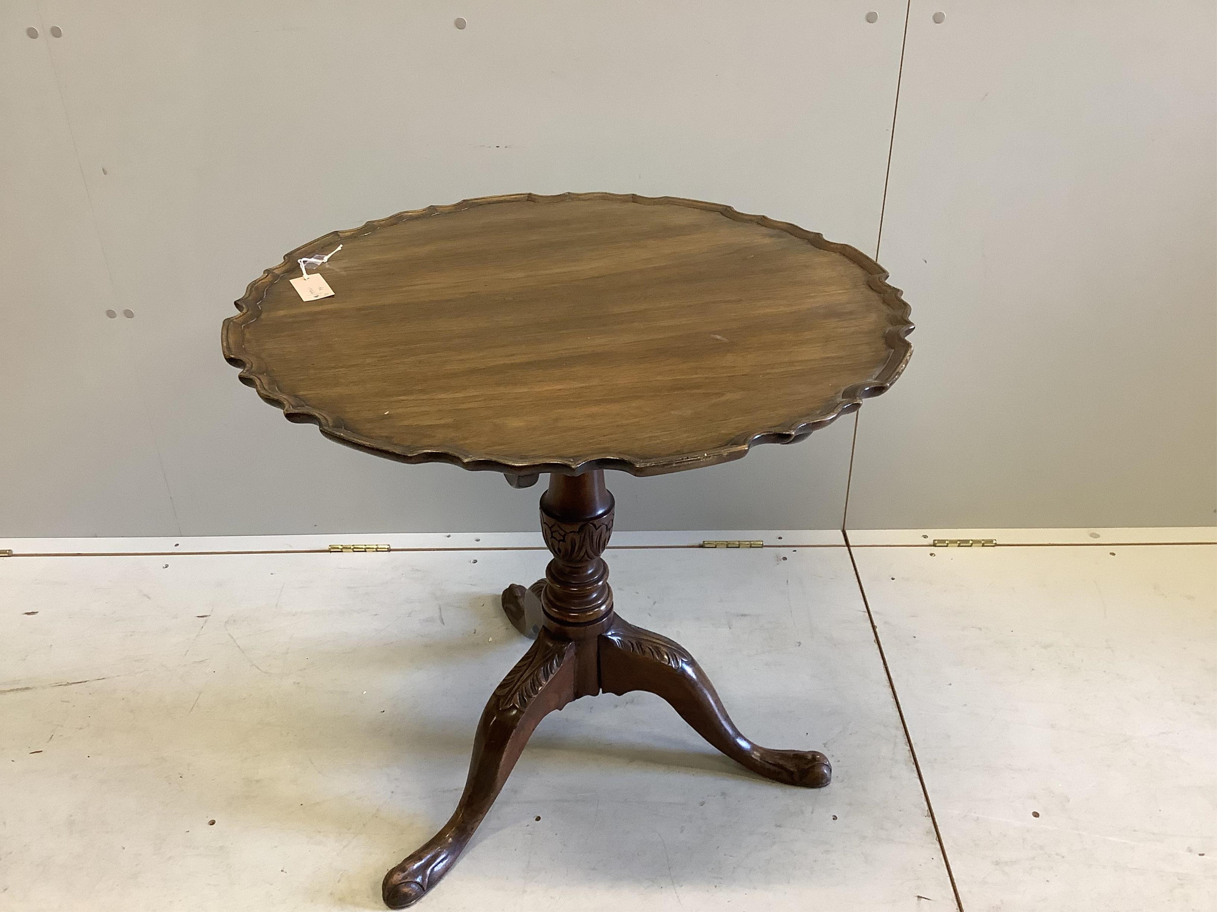 A Georgian style mahogany pie crust tripod table, width 75cm, height 72cm. Condition - fair, top a little faded